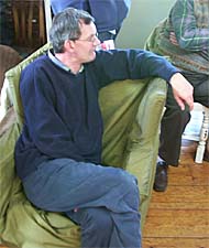 Martin Parr intently watching a workshop presentation